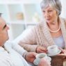 Portrait of mature man and his wife drinking tea and interacting